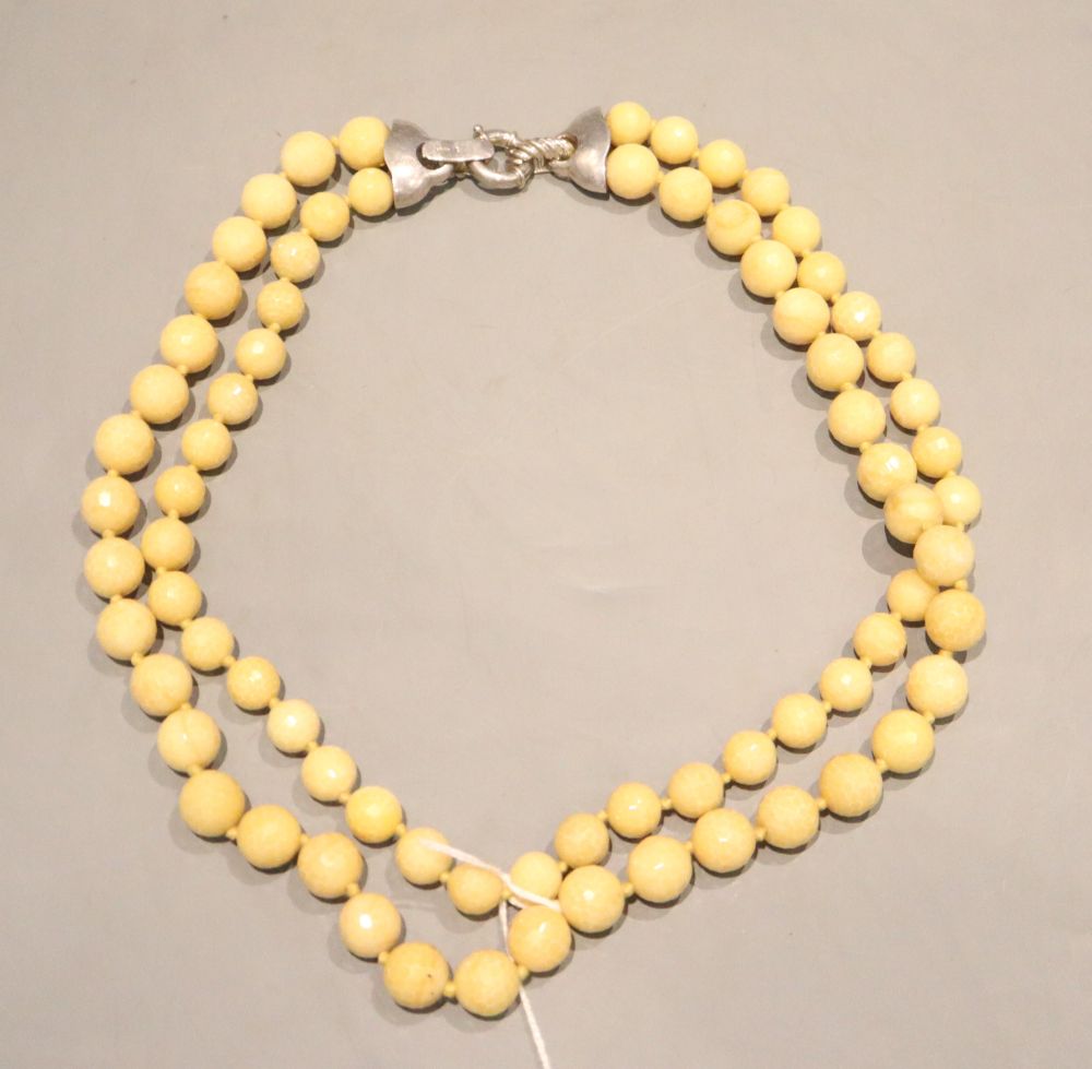 A 20th century double strand graduated facetted hardstone necklace with 925 clasp, 60cm.